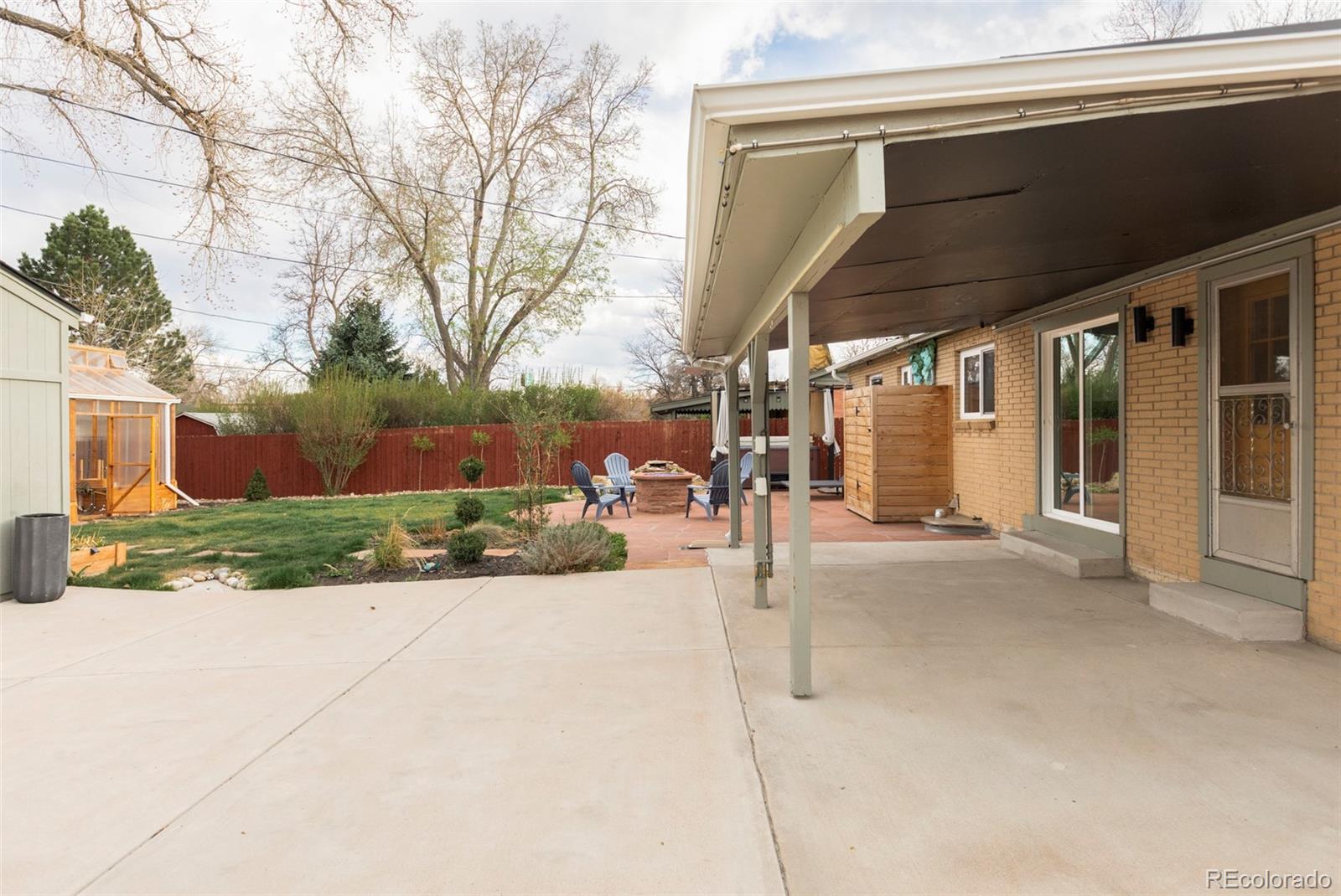 3406 South Stuart Street Denver, CO 80236 - Photo 31 of 34 a view of a house with a street