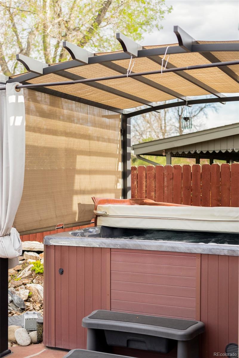 3406 South Stuart Street Denver, CO 80236 - Photo 32 of 34 a bathroom with a sink and a mirror