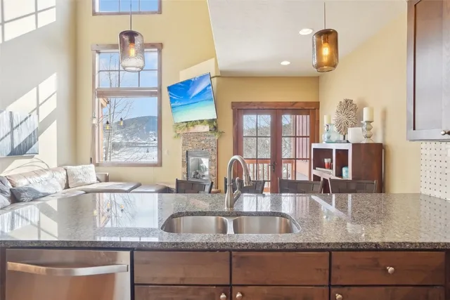 a kitchen with granite countertop a sink and a counter top space