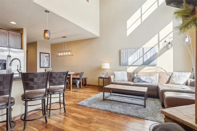 a living room with furniture and a table