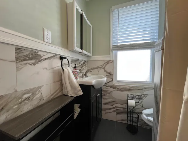 a bathroom with a sink and a mirror