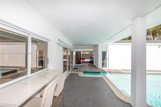 a view of a living room and entry way