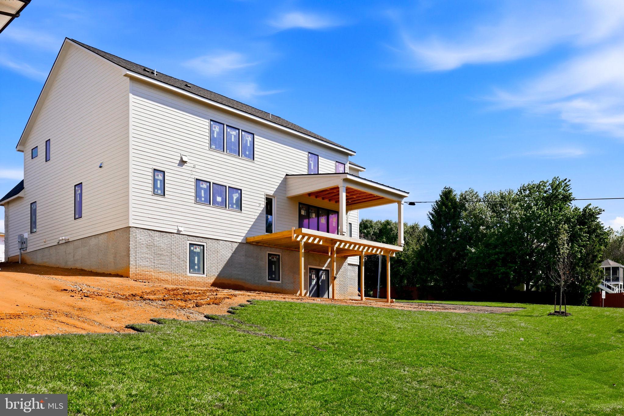 10801 Mason Hunt Court Reston, VA 20190 - Photo 9 of 26 a front view of a house with a yard