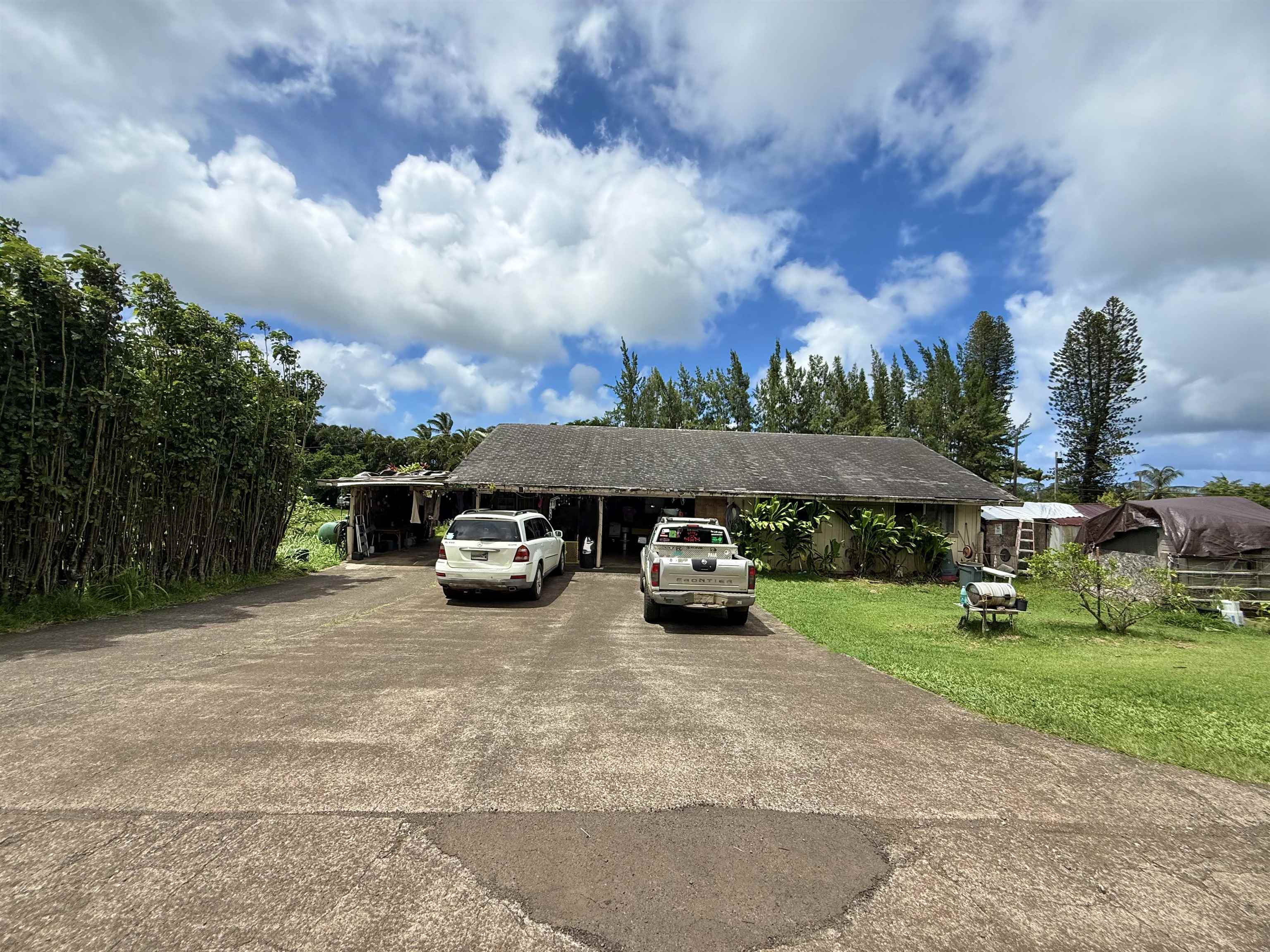 1630 Kauhikoa Road Haiku, HI 96708 - Photo 8 of 48 a view of a car parked in front of a house