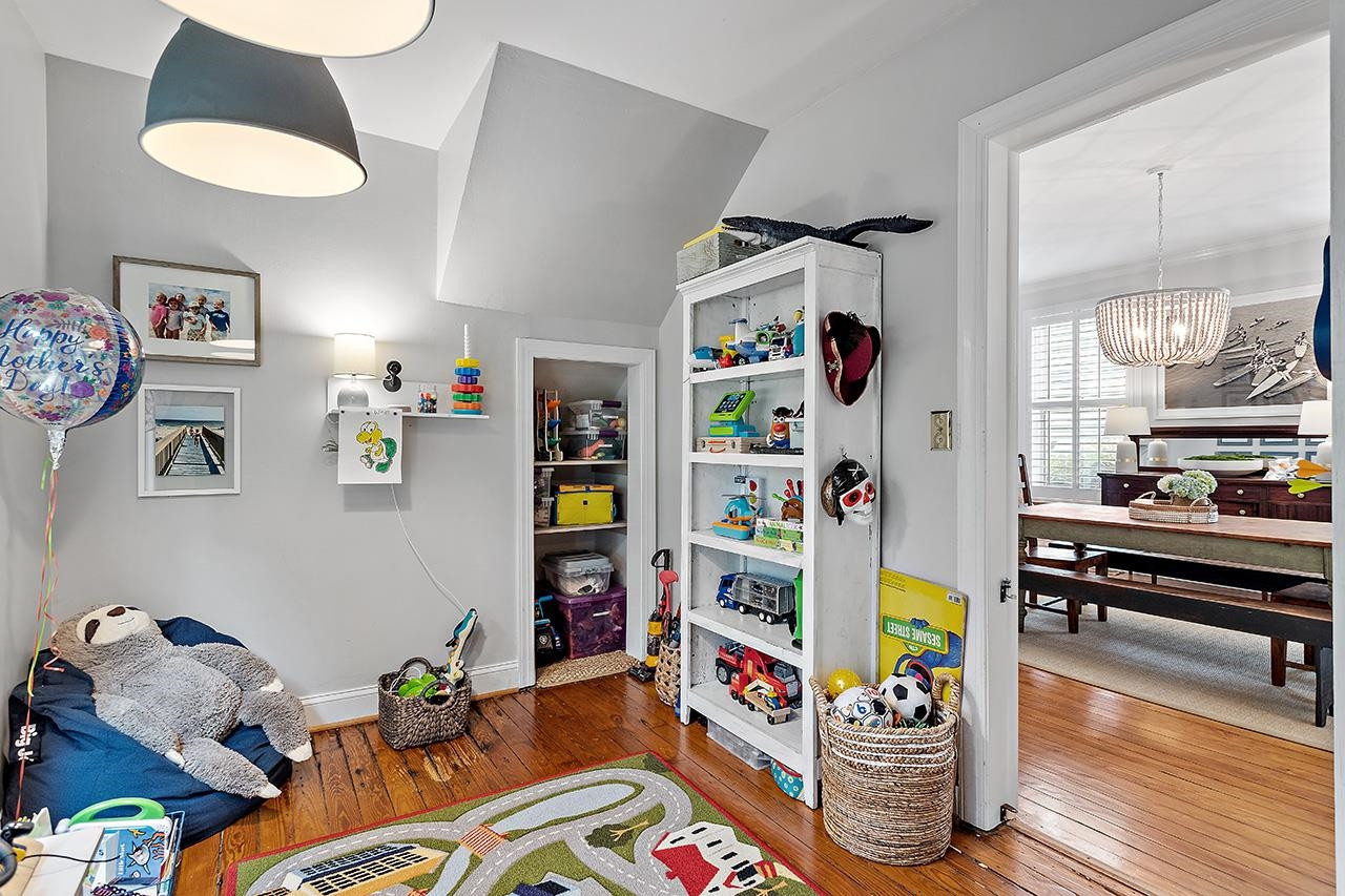502 Cleveland Street Raleigh, NC 27605 - Photo 14 of 36 a room with furniture and a bed