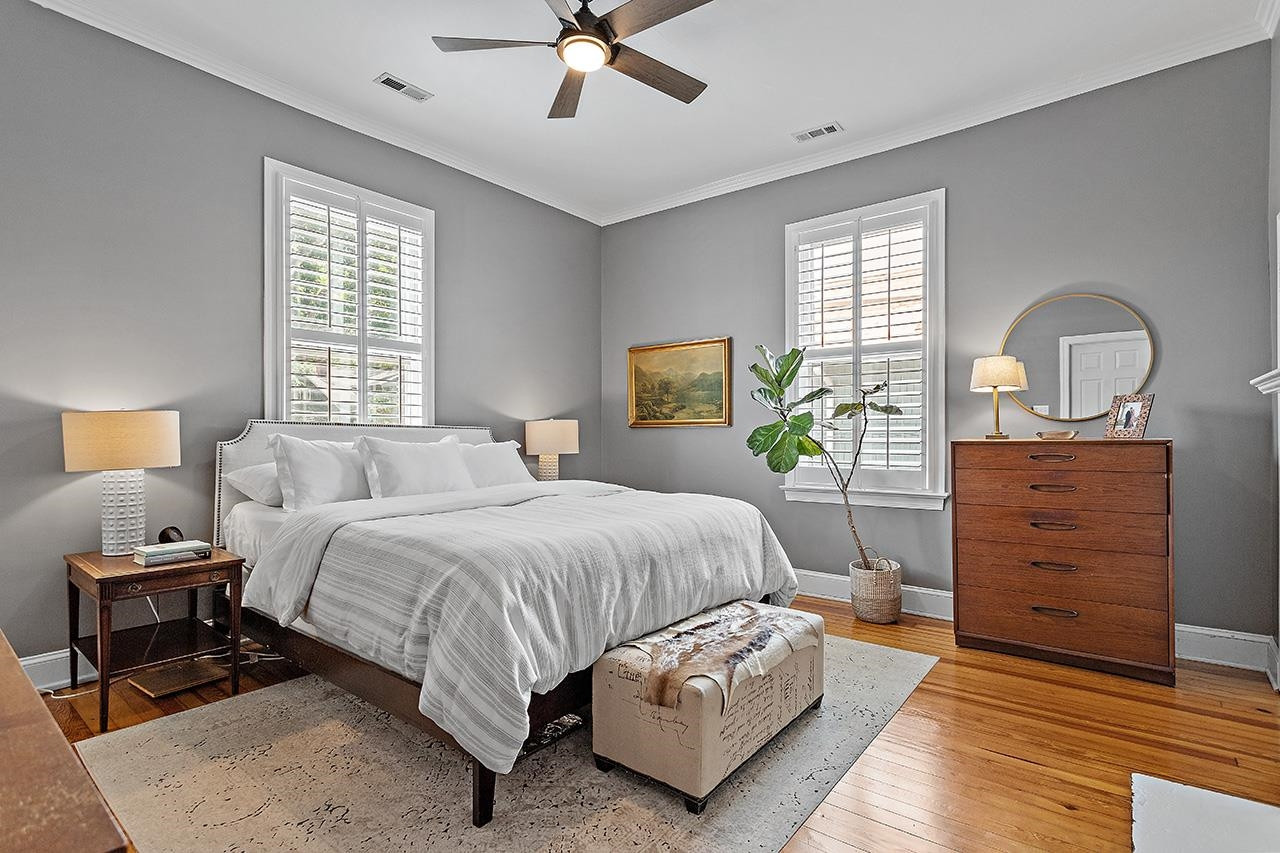 502 Cleveland Street Raleigh, NC 27605 - Photo 16 of 36 a bedroom with a bed and window