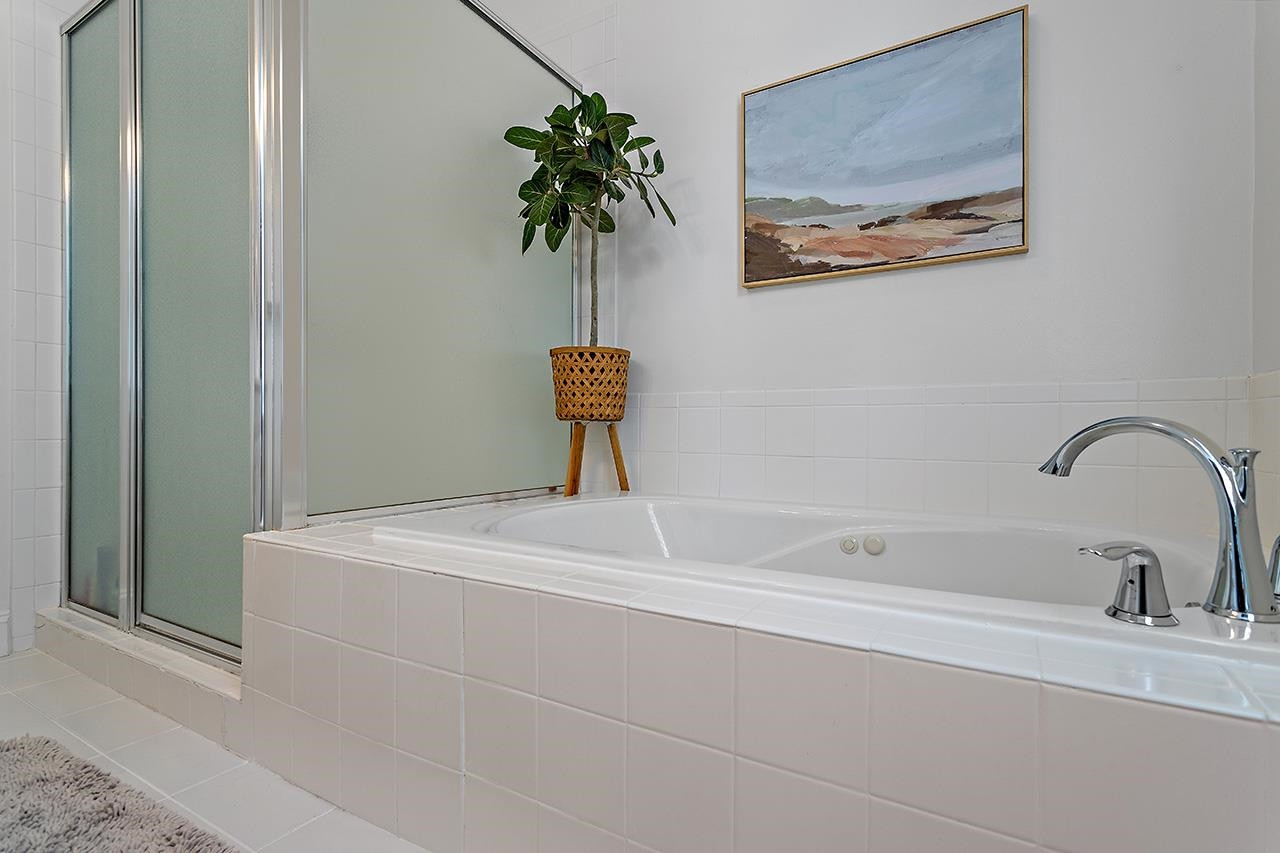 502 Cleveland Street Raleigh, NC 27605 - Photo 18 of 36 a bathroom with a bathtub and a sink