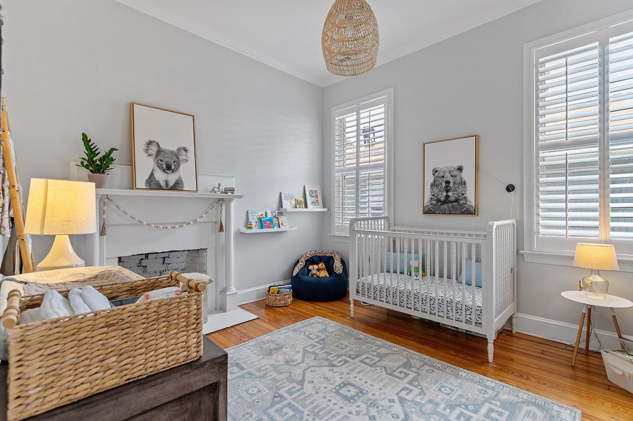502 Cleveland Street Raleigh, NC 27605 - Photo 19 of 36 a bedroom with furniture and a window