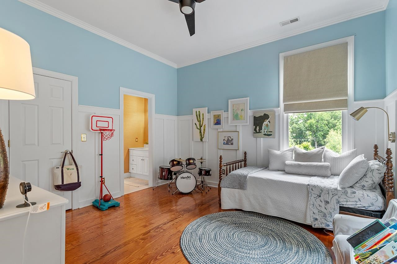 502 Cleveland Street Raleigh, NC 27605 - Photo 20 of 36 a living room with furniture a window and gym equipment