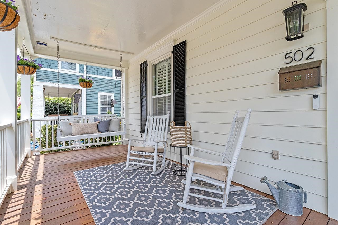 502 Cleveland Street Raleigh, NC 27605 - Photo 2 of 36 a porch with a bench and next to a window