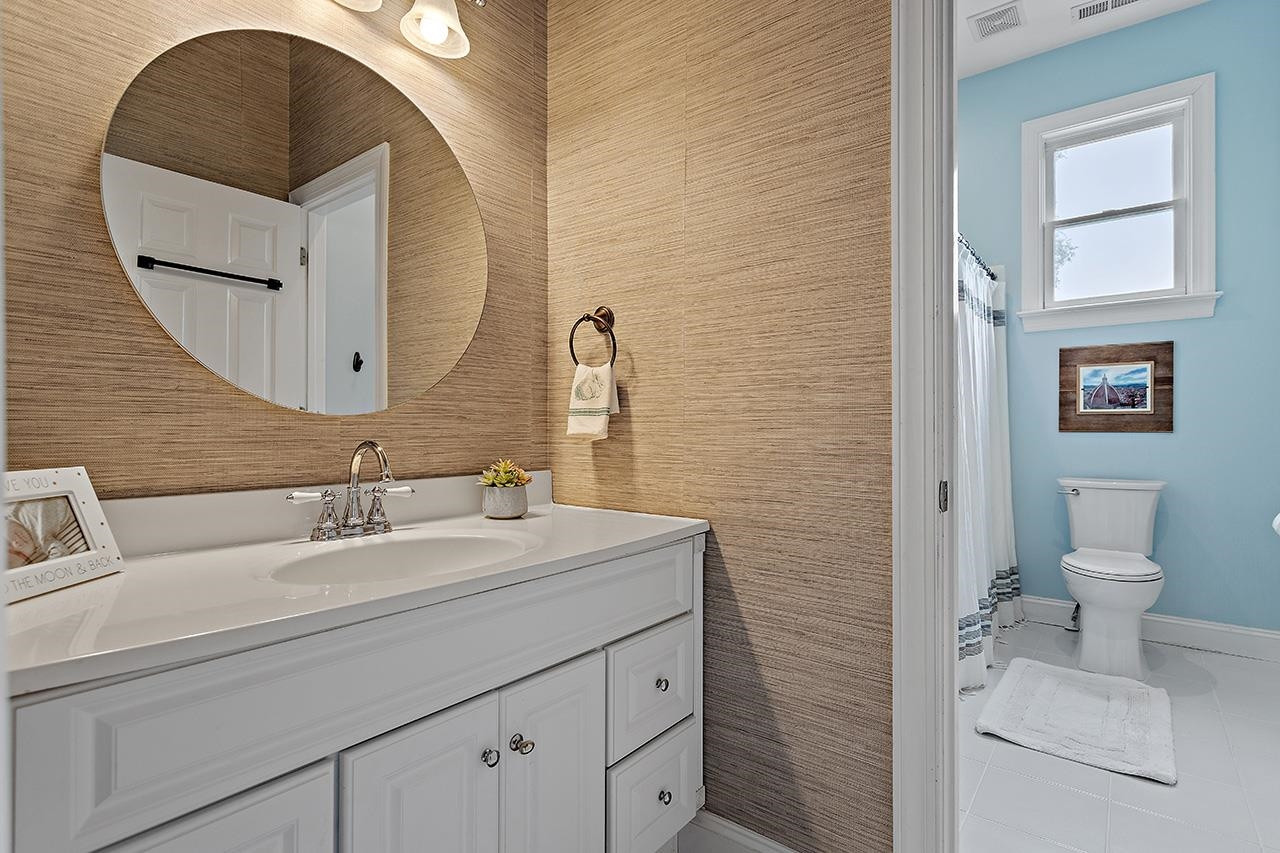 502 Cleveland Street Raleigh, NC 27605 - Photo 21 of 36 a bathroom with a sink and a mirror
