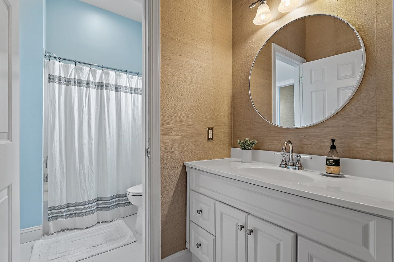502 Cleveland Street Raleigh, NC 27605 - Photo 22 of 36 a bathroom with a sink and a mirror