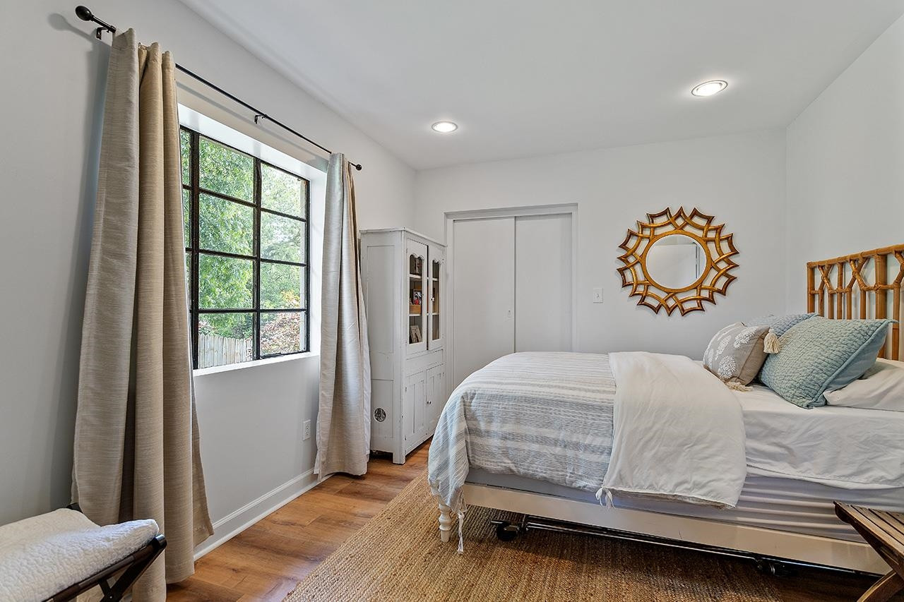 502 Cleveland Street Raleigh, NC 27605 - Photo 26 of 36 a bedroom with a bed and window