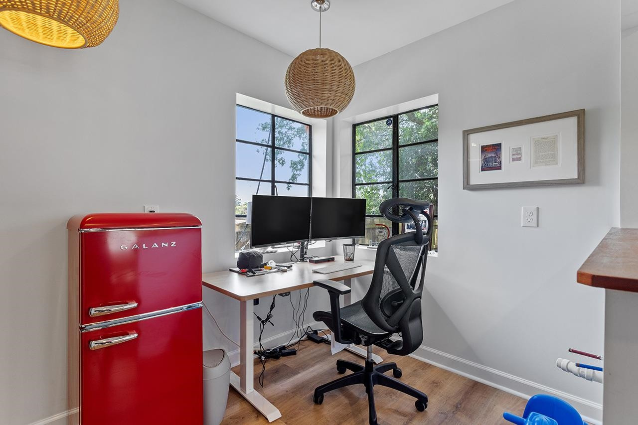502 Cleveland Street Raleigh, NC 27605 - Photo 27 of 36 a view of a workspace with furniture and a window