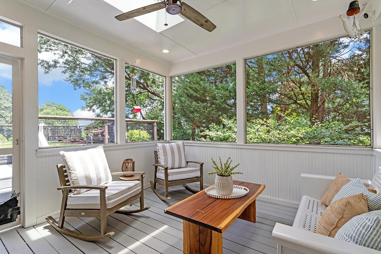 502 Cleveland Street Raleigh, NC 27605 - Photo 29 of 36 a living room with furniture and a floor to ceiling window