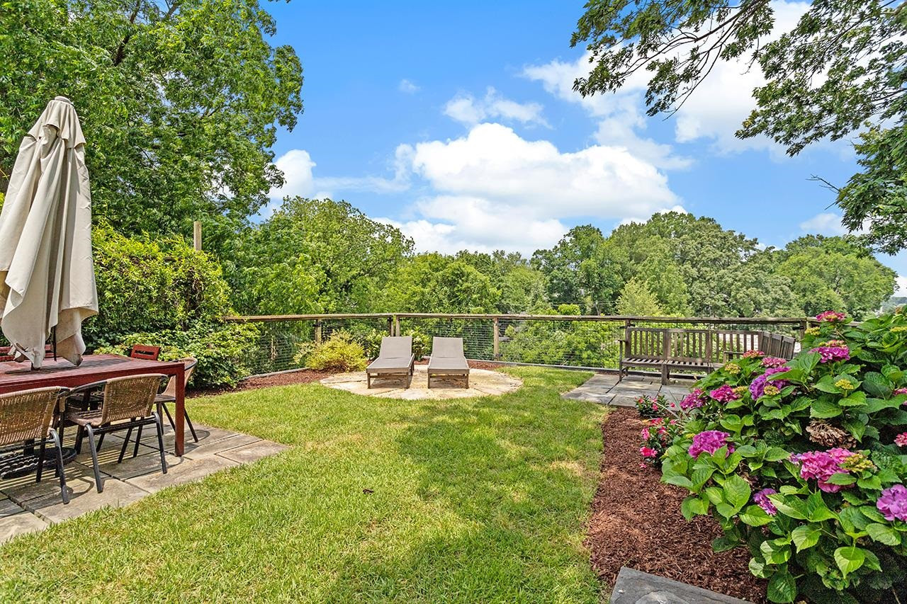 502 Cleveland Street Raleigh, NC 27605 - Photo 30 of 36 a view of a chair and tables in the patio