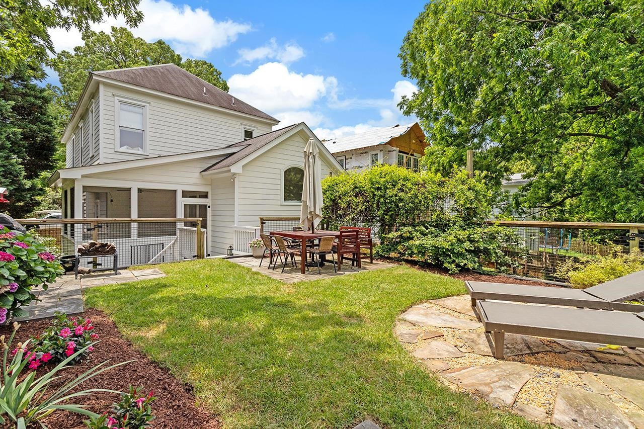 502 Cleveland Street Raleigh, NC 27605 - Photo 31 of 36 a view of a house with backyard porch and sitting area