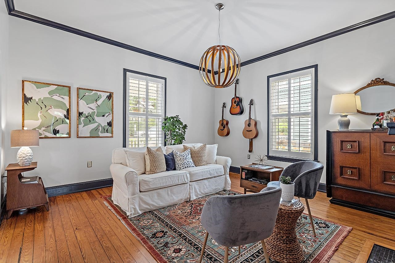 502 Cleveland Street Raleigh, NC 27605 - Photo 4 of 36 a living room with fireplace furniture and a window