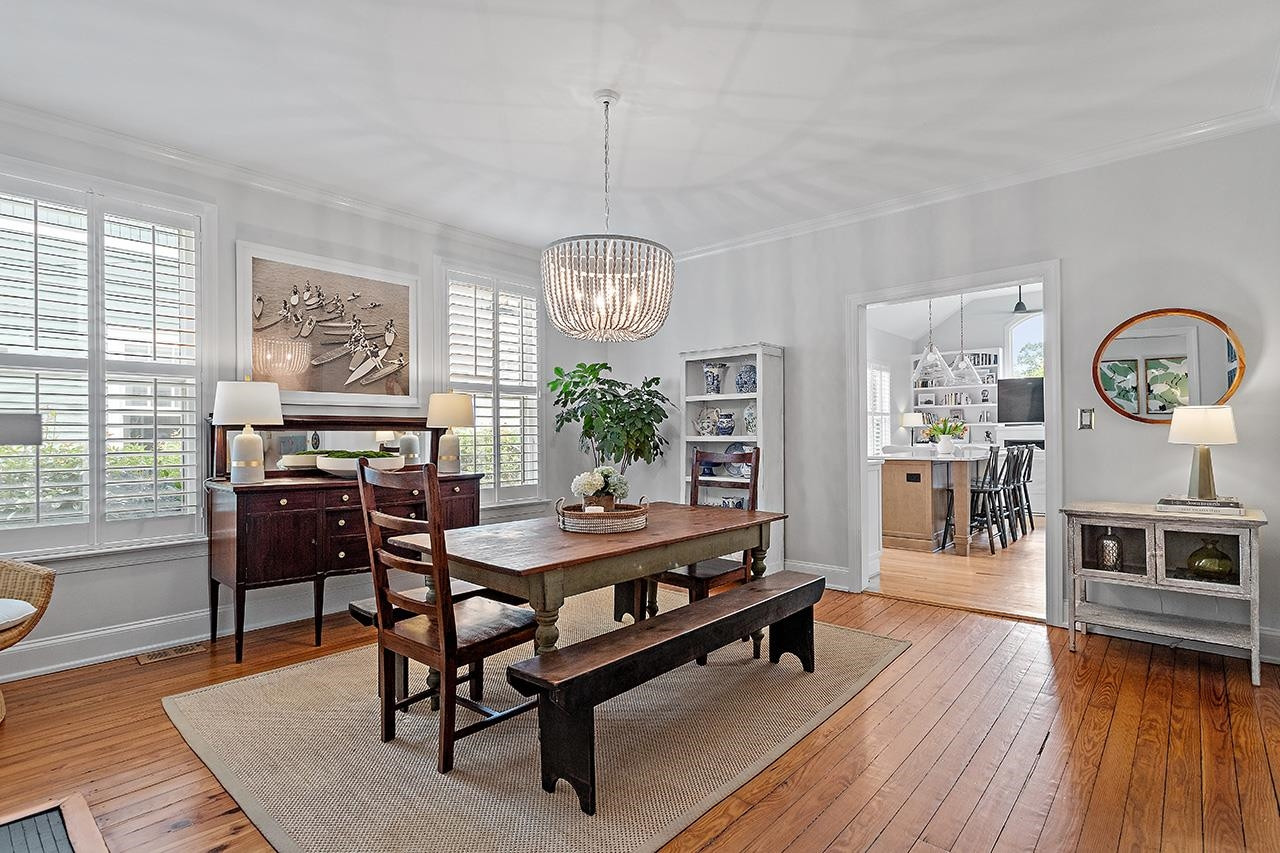 502 Cleveland Street Raleigh, NC 27605 - Photo 5 of 36 a view of a dining room with furniture window and wooden floor