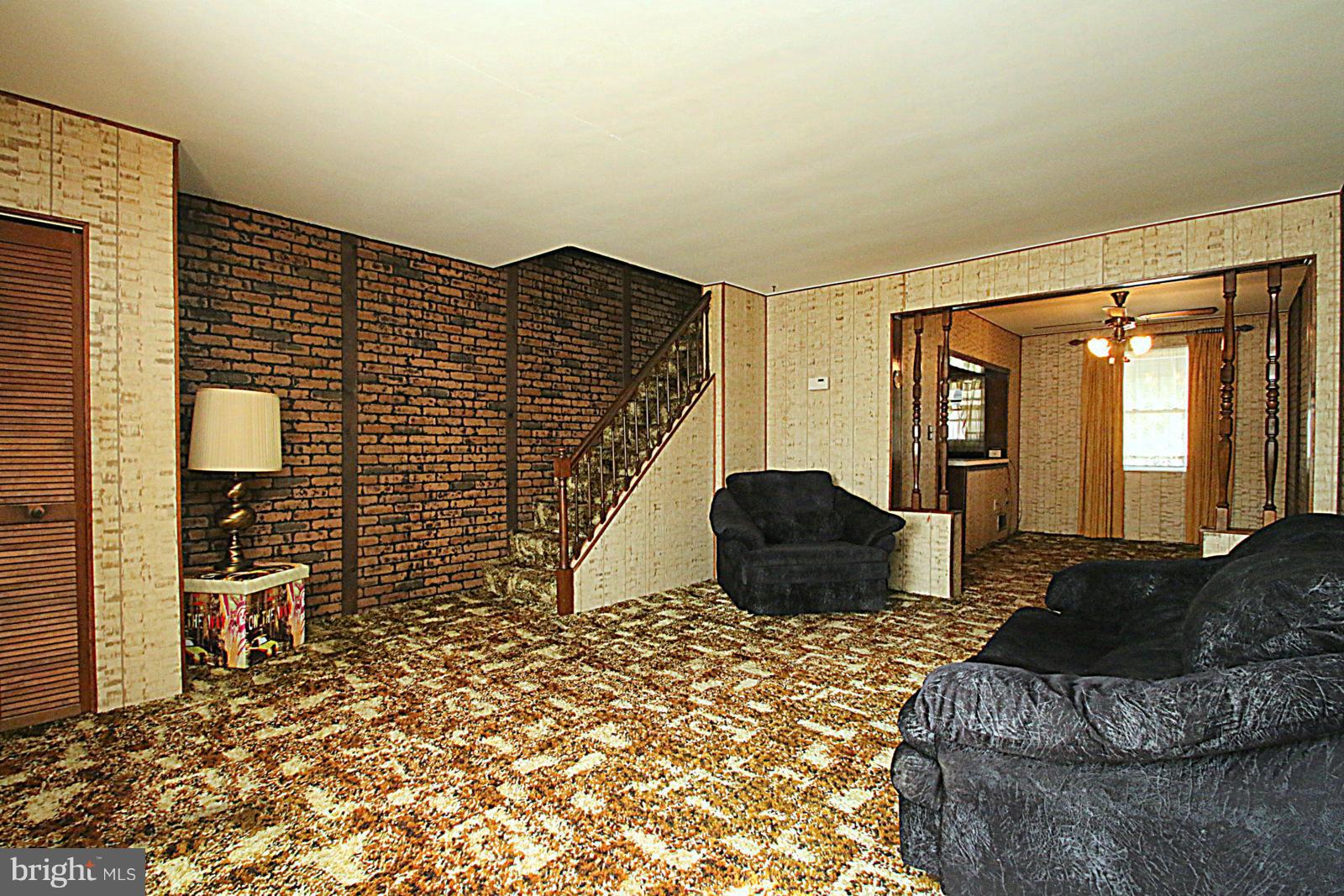 2004 Jasmine Road Baltimore, MD 21222 - Photo 2 of 29 a bedroom with a bed and wooden floor