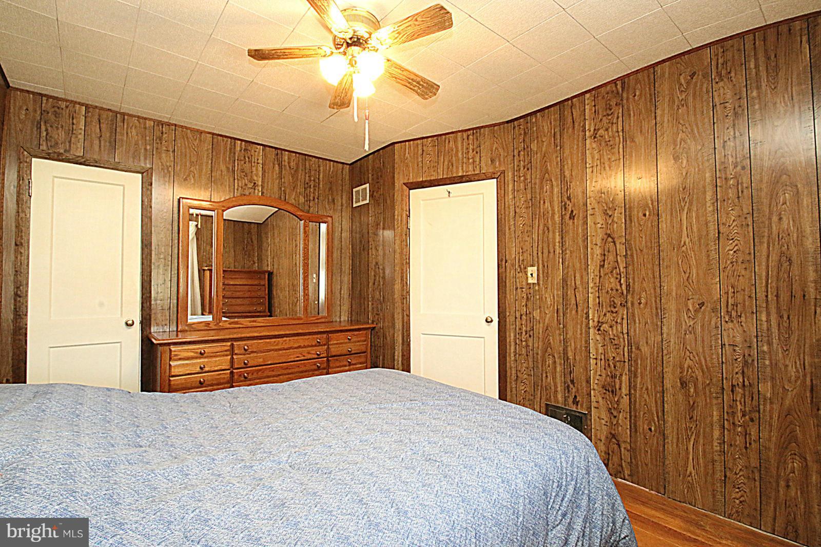 2004 Jasmine Road Baltimore, MD 21222 - Photo 18 of 29 a bedroom with a bed and wooden floor