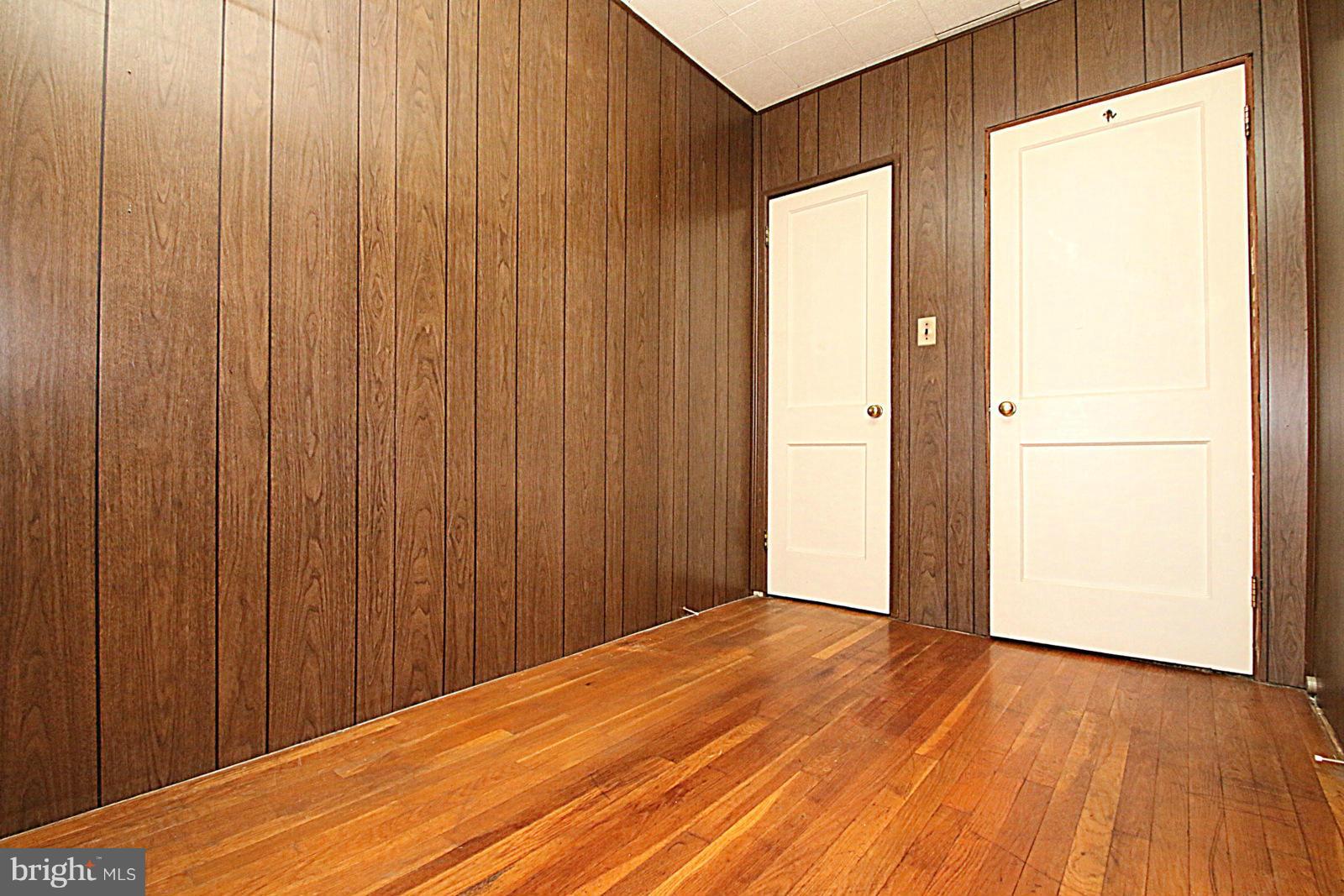 2004 Jasmine Road Baltimore, MD 21222 - Photo 21 of 29 a view of a room with wooden floor and a gate
