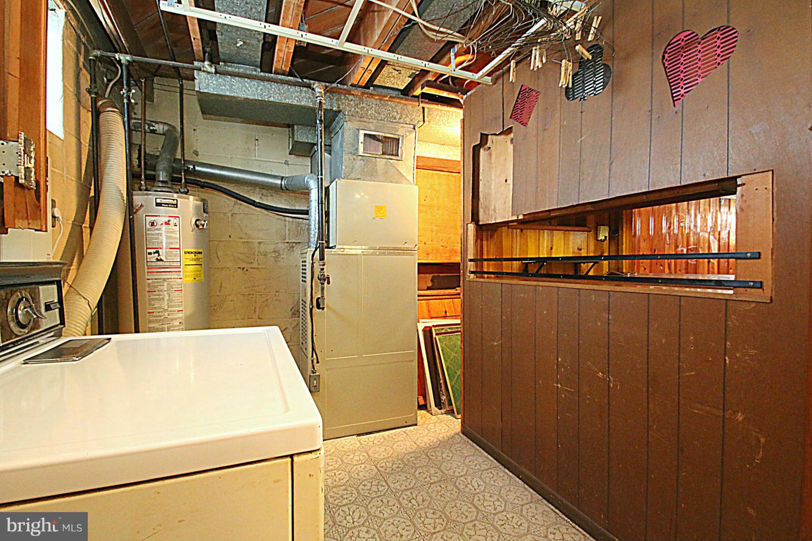 2004 Jasmine Road Baltimore, MD 21222 - Photo 26 of 29 a view of a storage & utility room with washer and dryer