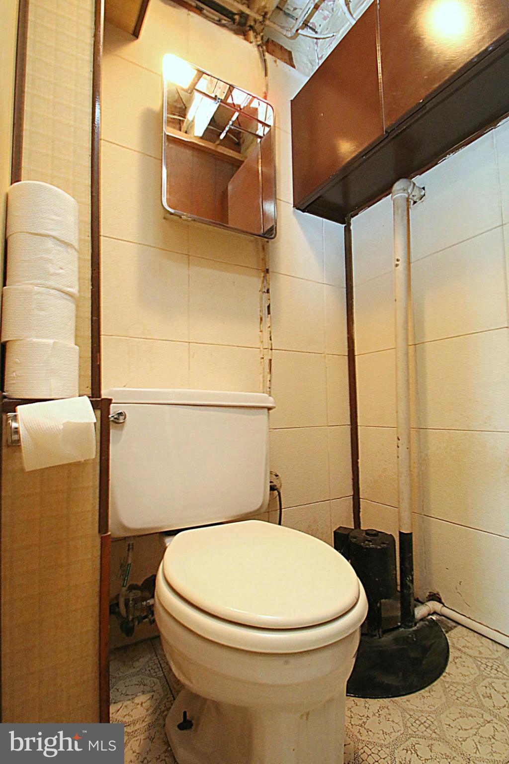 2004 Jasmine Road Baltimore, MD 21222 - Photo 29 of 29 a bathroom with a toilet and a shower