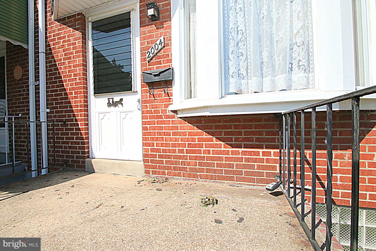 2004 Jasmine Road Baltimore, MD 21222 - Photo 5 of 29 a view of a door and a window