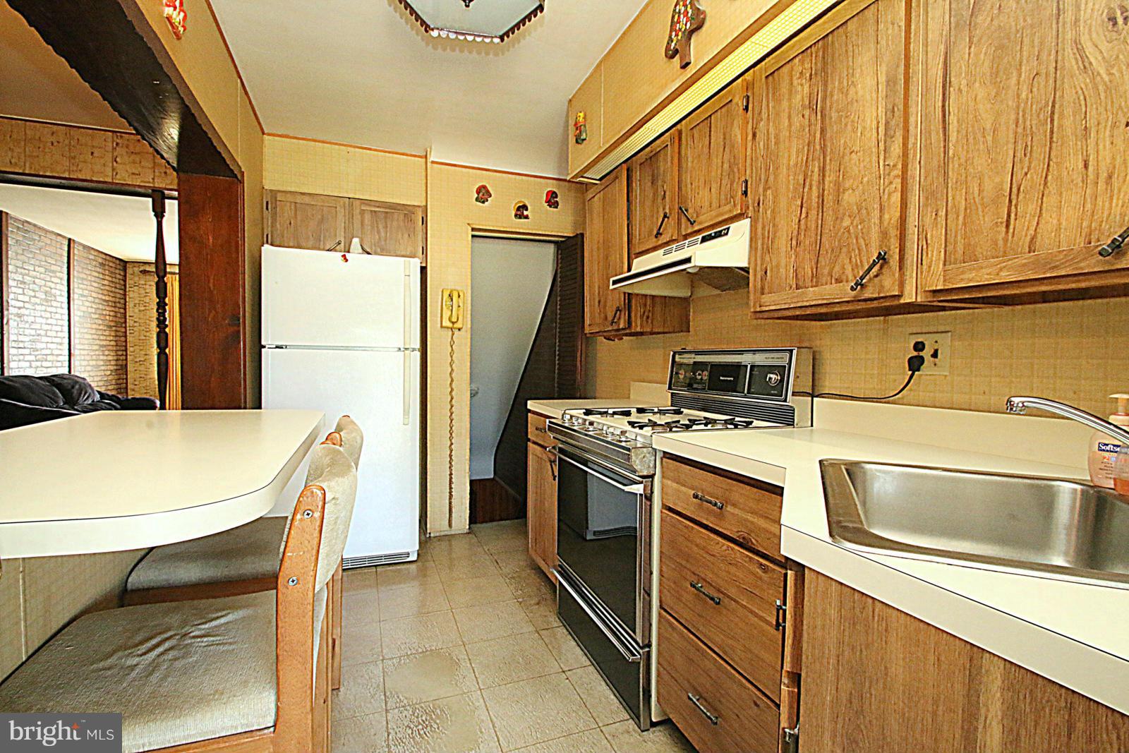 2004 Jasmine Road Baltimore, MD 21222 - Photo 8 of 29 a kitchen that has a sink stainless steel appliances and cabinets
