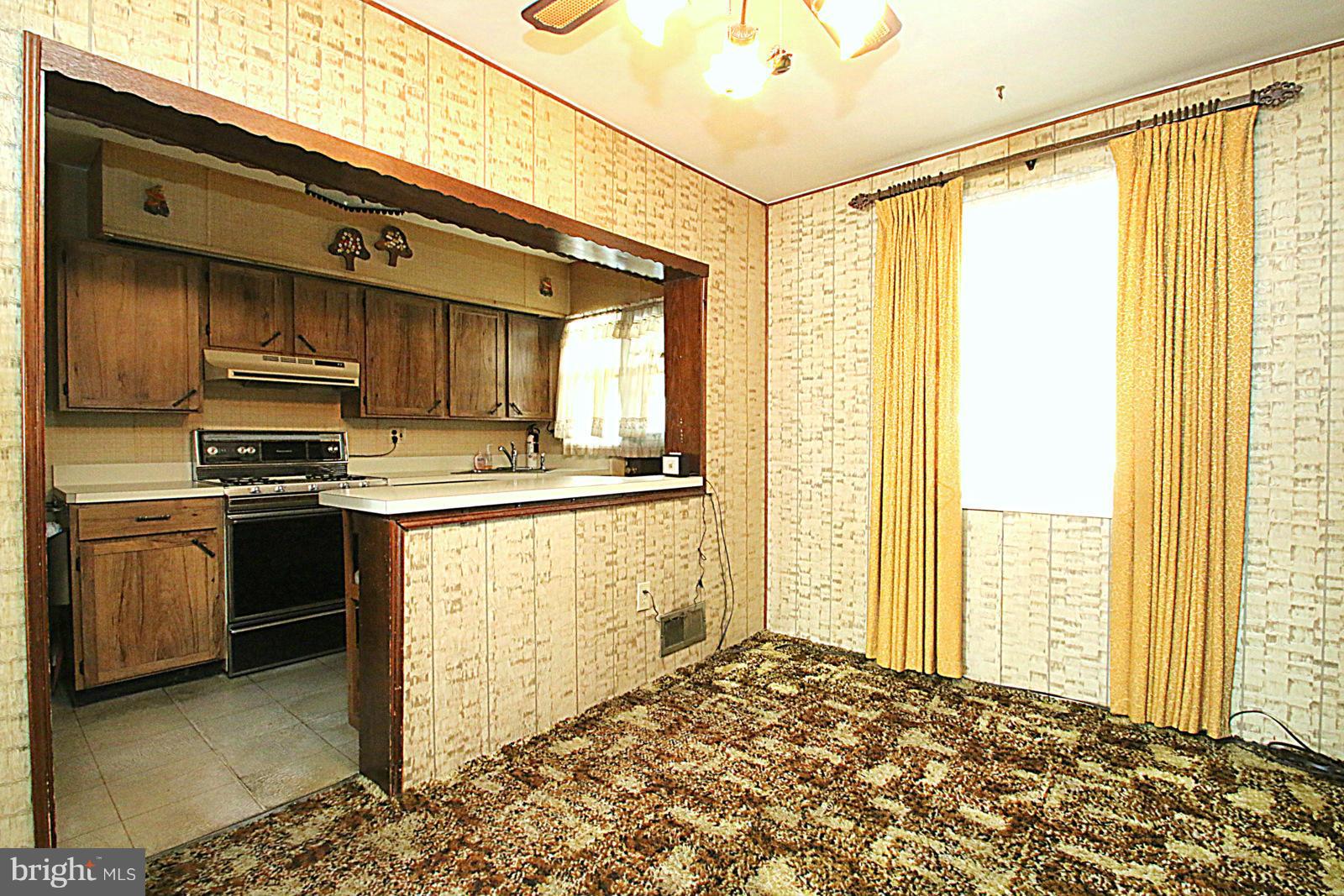2004 Jasmine Road Baltimore, MD 21222 - Photo 10 of 29 a kitchen with a stove a sink and a refrigerator