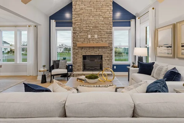 a living room with furniture and a fireplace