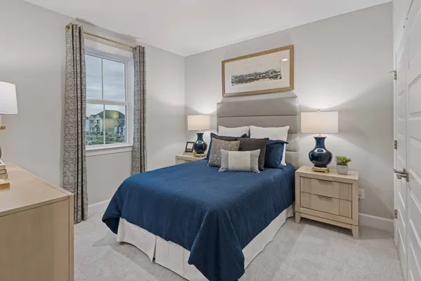 a bedroom with a bed and window