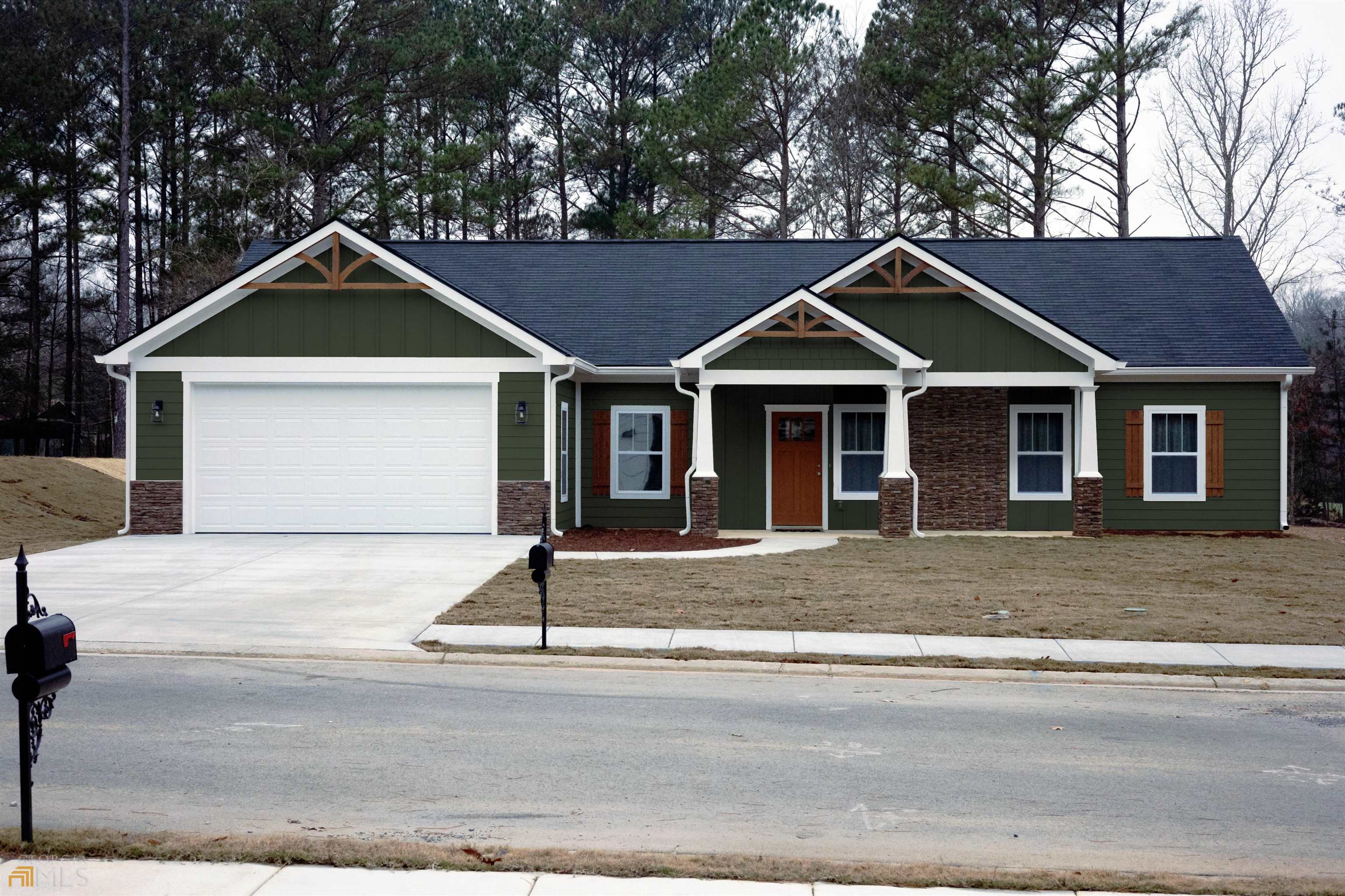 8 Gowen Drive Rome, GA 30165 - Photo 1 of 1 a front view of a house with a yard and garage