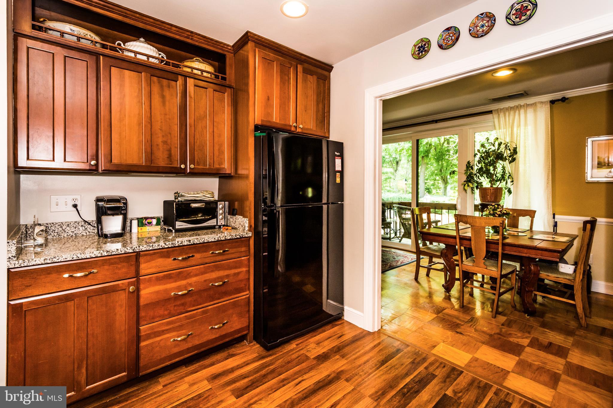Cherry cabinets coordinate well with flooring.