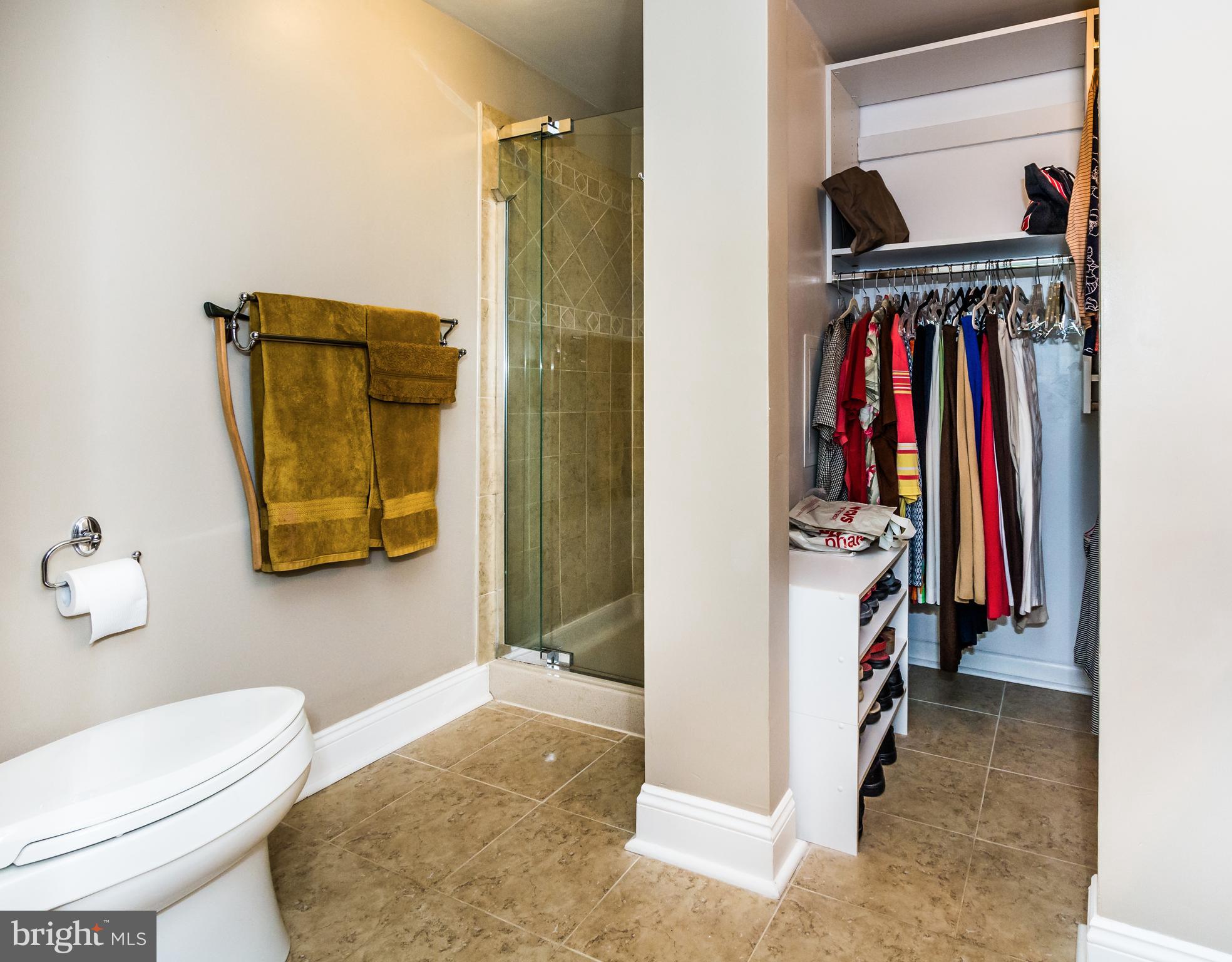22 Cross Keys Road, Unit 22C Baltimore, MD 21210 - Photo 18 of 38 Master Bath: tiled shower and walk-in closet.