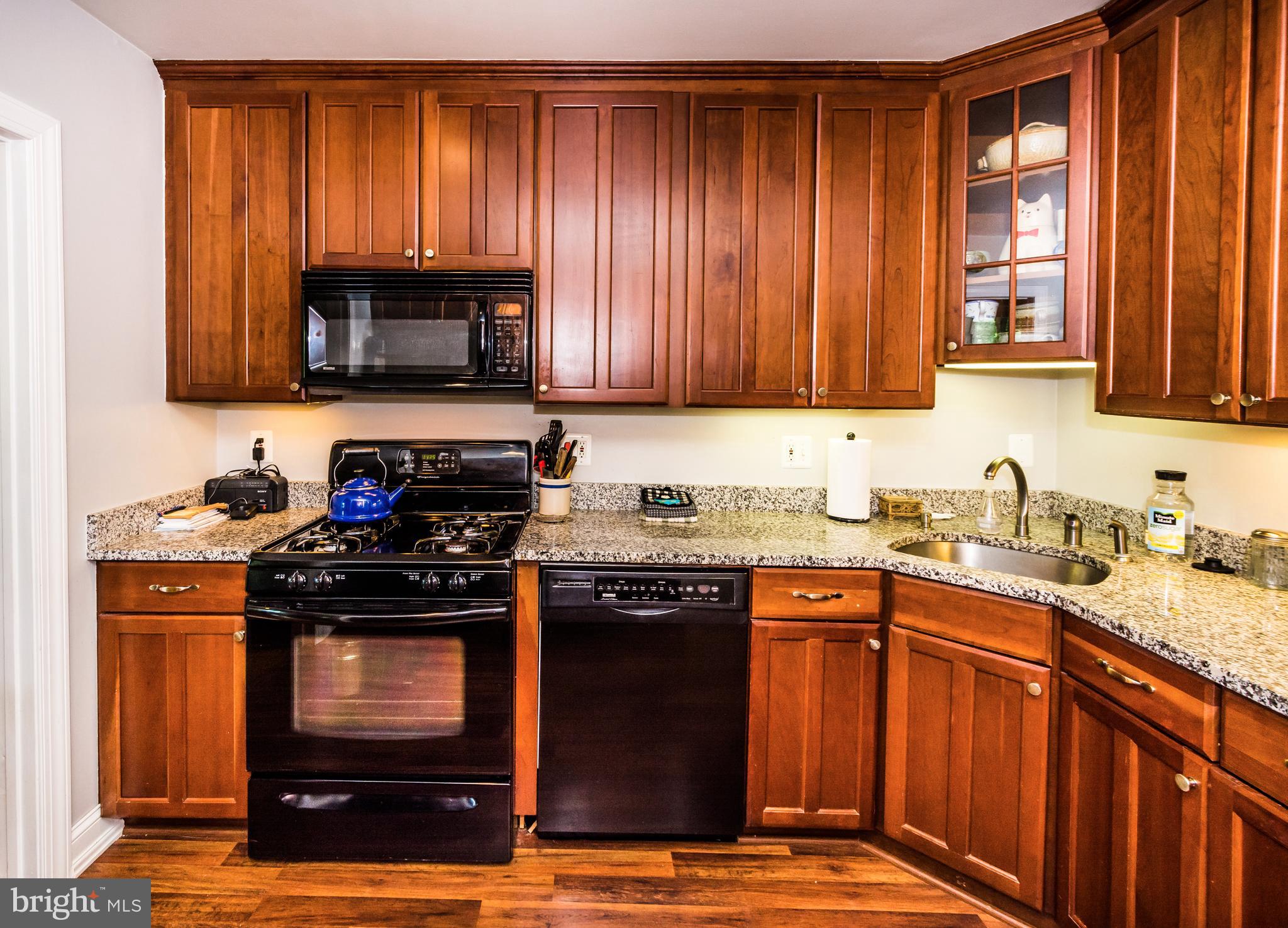 22 Cross Keys Road, Unit 22C Baltimore, MD 21210 - Photo 3 of 38 Newer granite countertops and cherry cabinets.