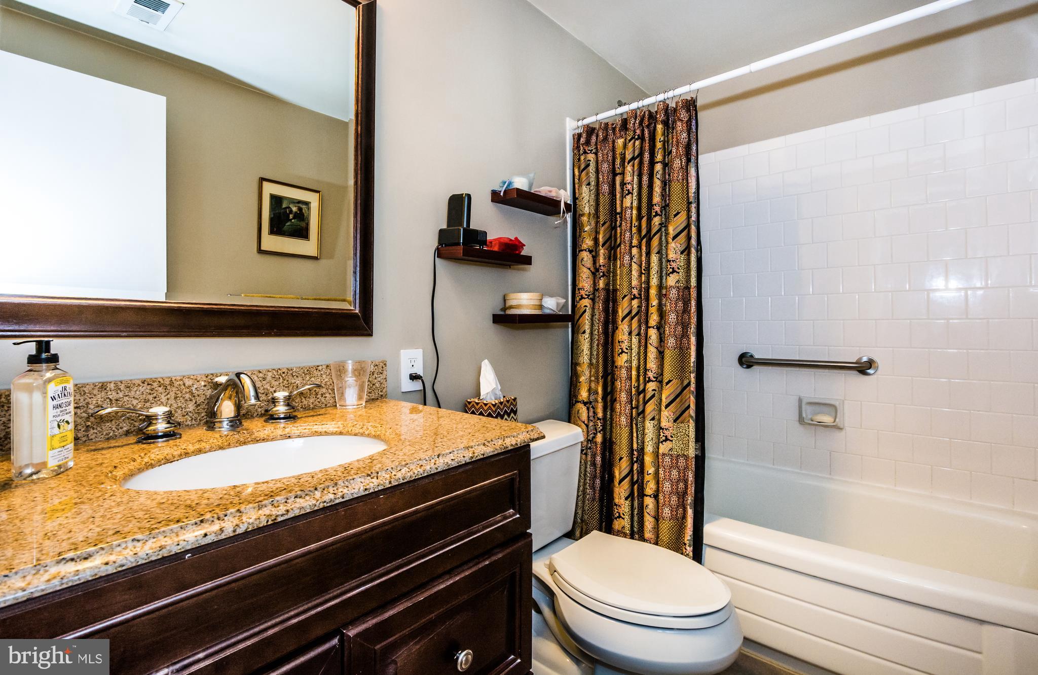 22 Cross Keys Road, Unit 22C Baltimore, MD 21210 - Photo 23 of 38 Second Bathroom, granite, tub/shower w/newer tile.