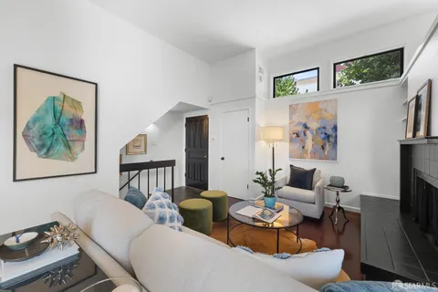 a bedroom with a bed a table and chair