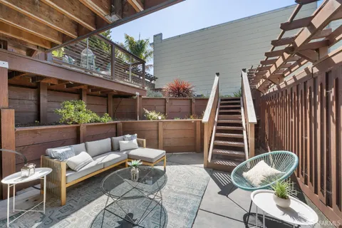 a view of a chairs and table in the terrace