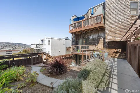 a view of a balcony with city view