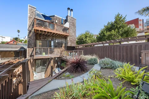 a kitchen with a dining table and chairs