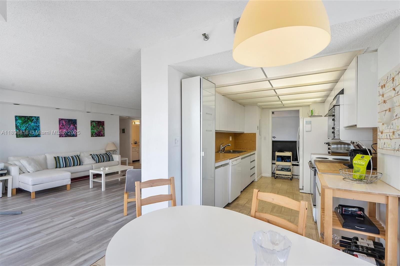 4000 Towerside Terrace, Unit 402 Miami, FL 33138 - Photo 15 of 54 a living room with furniture and a fireplace