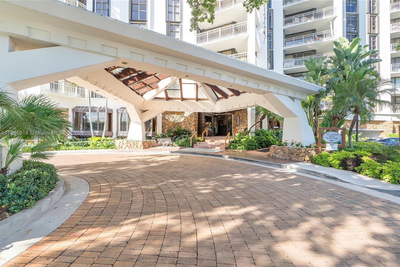 4000 Towerside Terrace, Unit 402 Miami, FL 33138 - Photo 2 of 54 a view of large building along with street