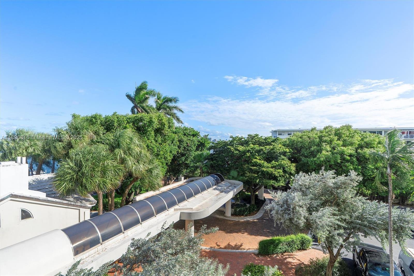 4000 Towerside Terrace, Unit 402 Miami, FL 33138 - Photo 38 of 54 a view of a backyard with plants and a garden