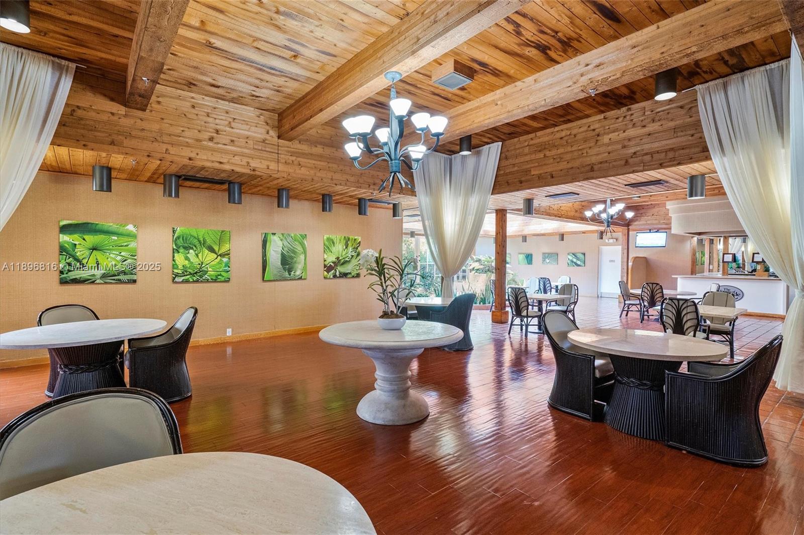 4000 Towerside Terrace, Unit 402 Miami, FL 33138 - Photo 44 of 54 a dining room with furniture wooden floor and windows