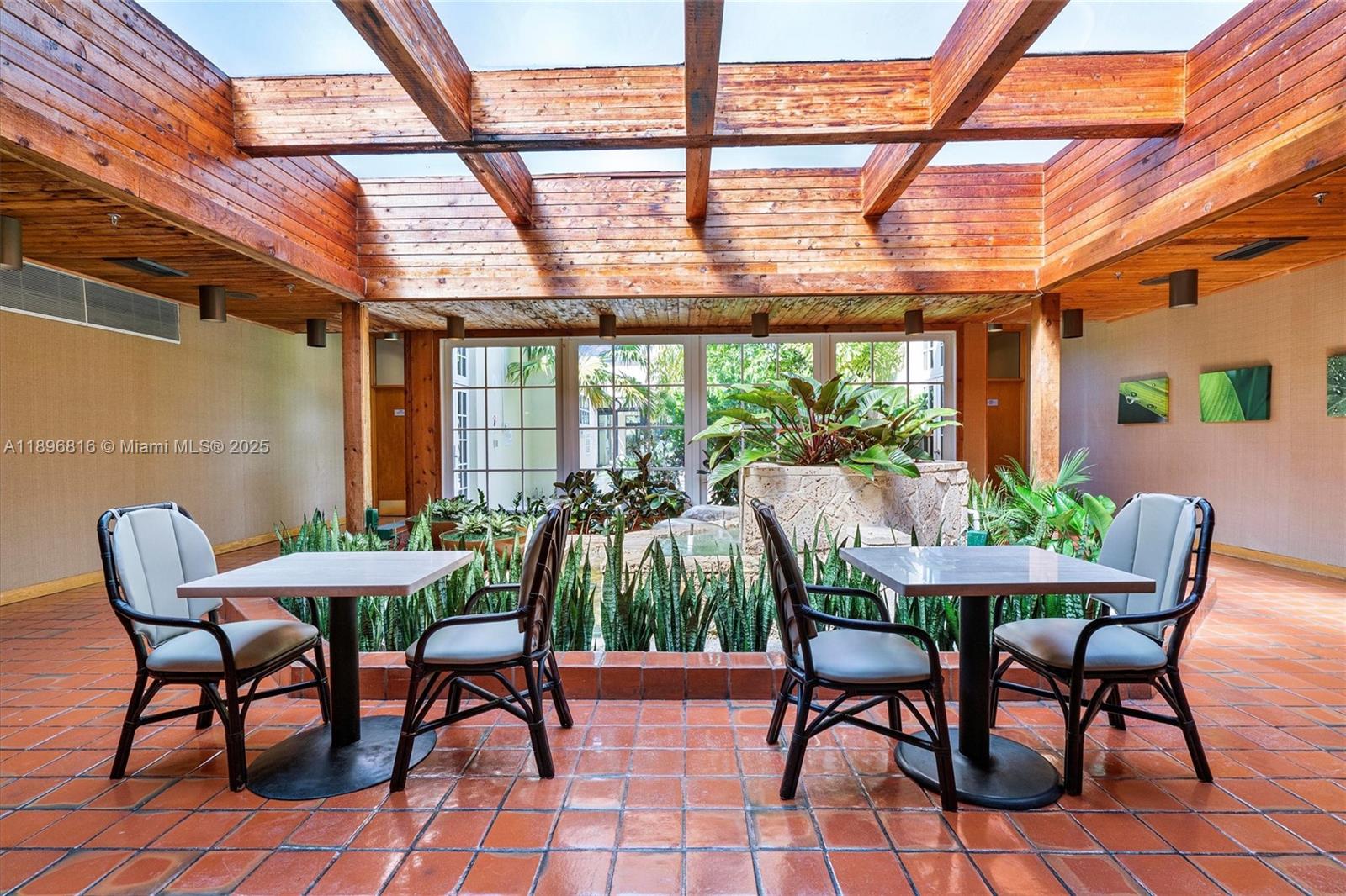 4000 Towerside Terrace, Unit 402 Miami, FL 33138 - Photo 45 of 54 a dining room with furniture and wooden floor