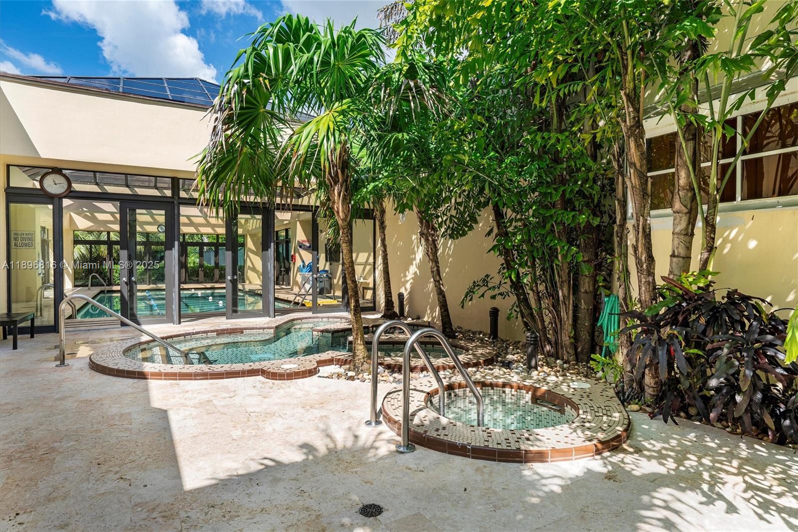 4000 Towerside Terrace, Unit 402 Miami, FL 33138 - Photo 46 of 54 a view of a fountain in the patio