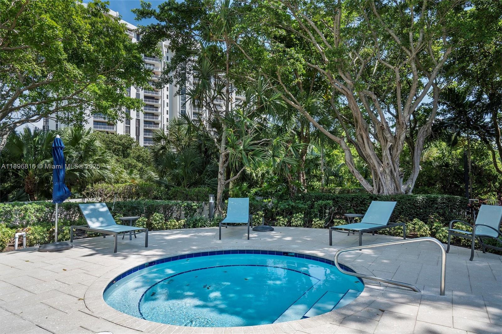 4000 Towerside Terrace, Unit 402 Miami, FL 33138 - Photo 53 of 54 a view of a swimming pool with sitting area