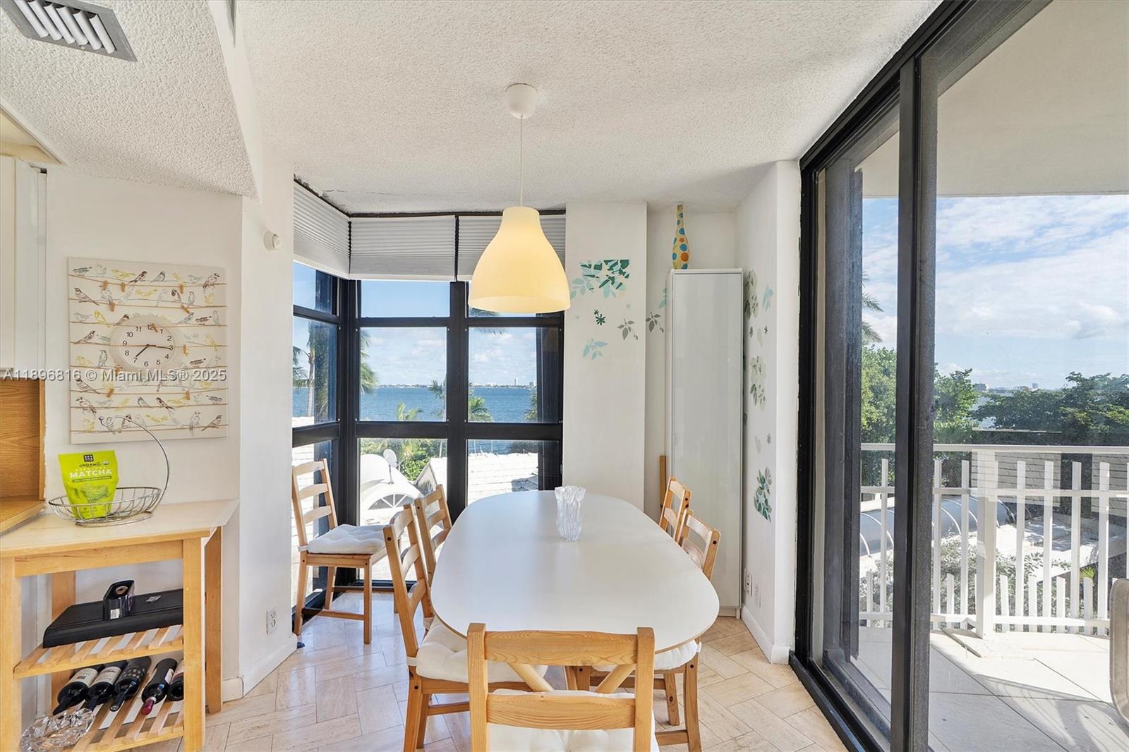 4000 Towerside Terrace, Unit 402 Miami, FL 33138 - Photo 10 of 54 a view of a livingroom with furniture window and wooden floor